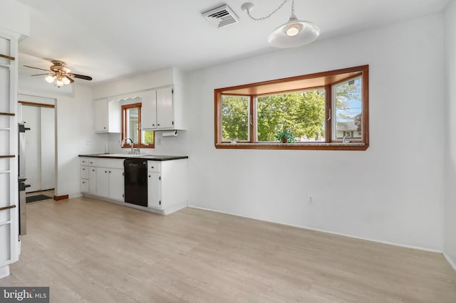 kitchen featuring visible vents, a healthy amount of sunlight, ceiling fan, black dishwasher, and white cabinets