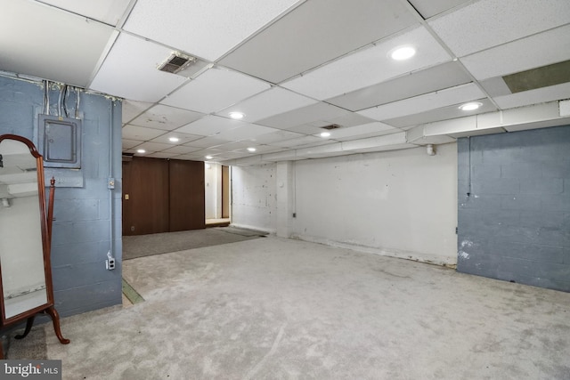 finished basement featuring recessed lighting, concrete block wall, and visible vents