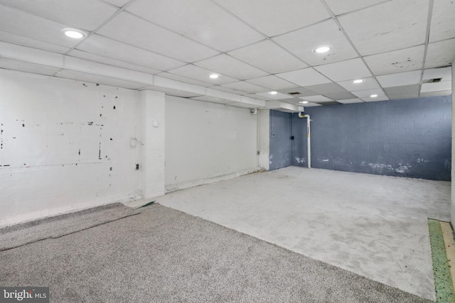 below grade area with recessed lighting and a paneled ceiling