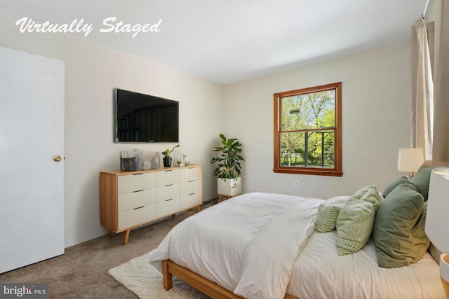 bedroom featuring light colored carpet
