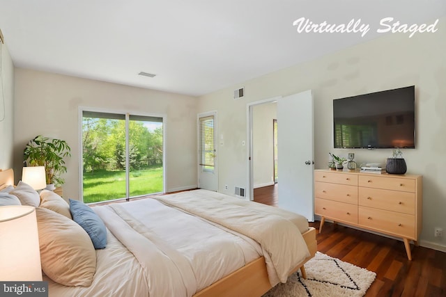 bedroom featuring baseboards, dark wood-style floors, and visible vents