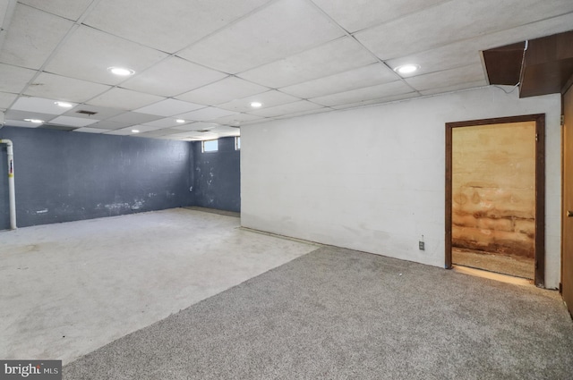 below grade area featuring recessed lighting and a paneled ceiling