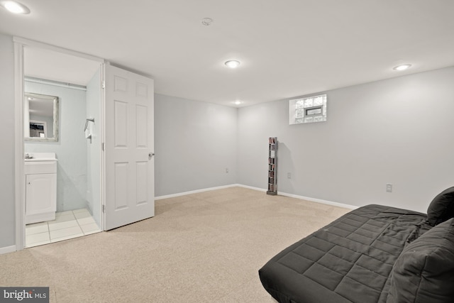 carpeted bedroom featuring recessed lighting, connected bathroom, baseboards, and washer / clothes dryer