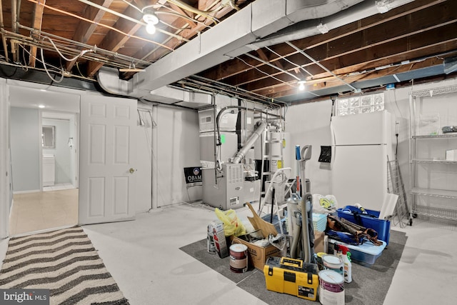 unfinished below grade area with visible vents, heating unit, and water heater