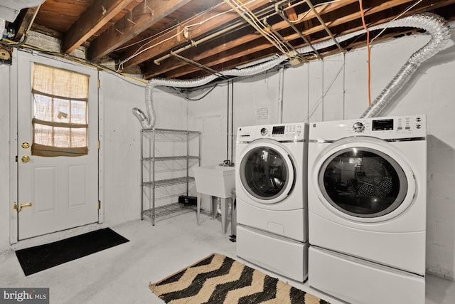 clothes washing area featuring laundry area and washer and dryer
