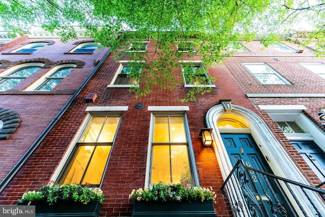 exterior space featuring brick siding
