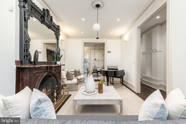 living room featuring recessed lighting, ornamental molding, and baseboards