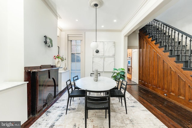 dining area with stairway, recessed lighting, ornamental molding, and dark wood finished floors