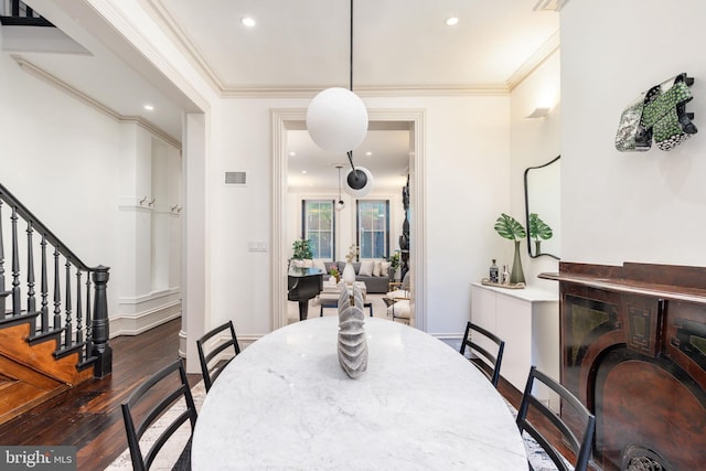 dining area with recessed lighting, wood finished floors, visible vents, ornamental molding, and stairway