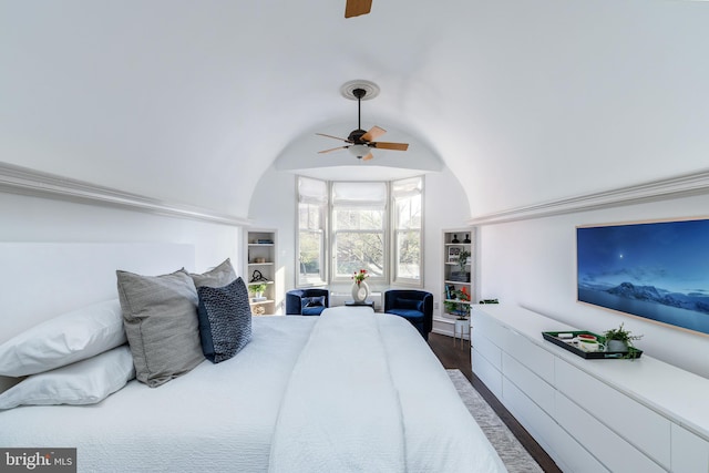 bedroom with dark wood finished floors, ceiling fan, and lofted ceiling