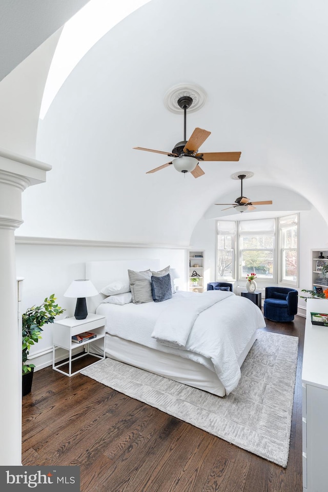 bedroom featuring ceiling fan, vaulted ceiling, and wood finished floors