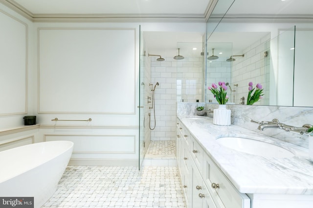 full bath with a sink, a freestanding tub, a shower stall, and double vanity