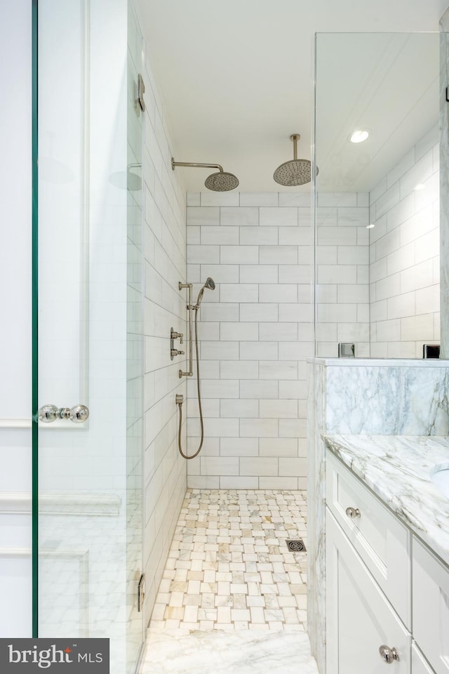 full bathroom featuring vanity and a stall shower