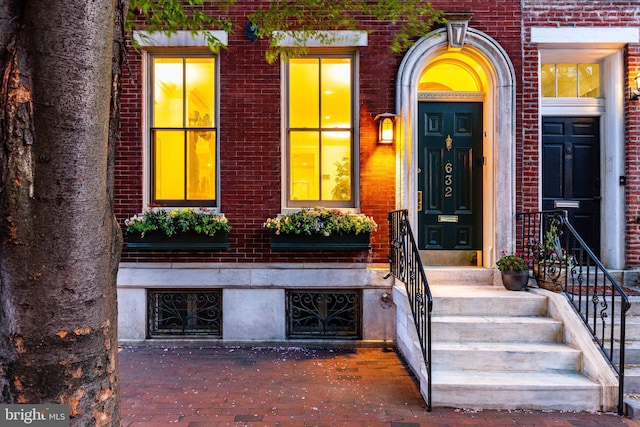 property entrance with brick siding