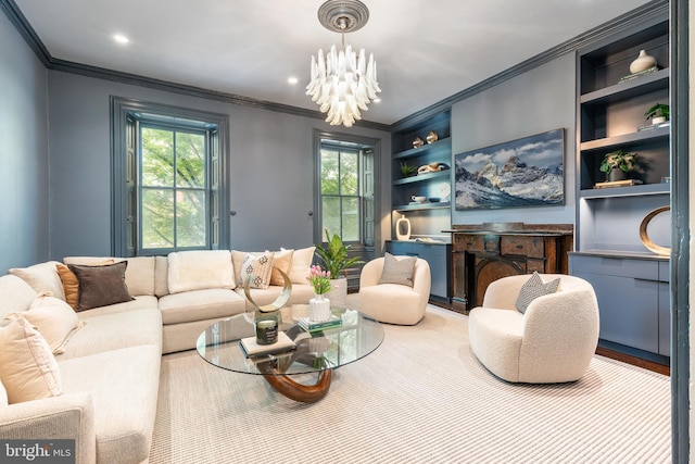 living room featuring built in features, a wealth of natural light, ornamental molding, and a chandelier
