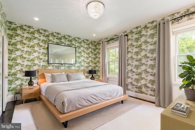 bedroom featuring recessed lighting, wallpapered walls, multiple windows, and baseboards