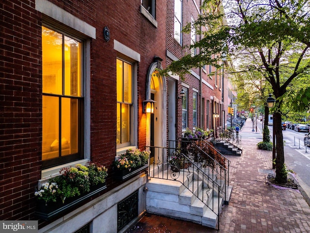 view of side of home featuring brick siding