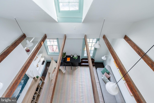 additional living space with carpet floors and lofted ceiling with skylight