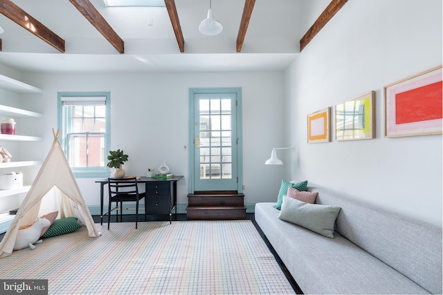 interior space featuring carpet and beamed ceiling