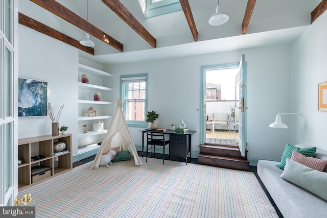interior space with beam ceiling and carpet
