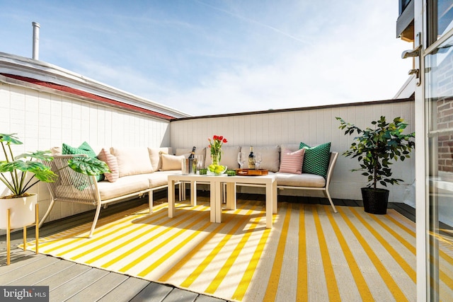 deck with an outdoor hangout area