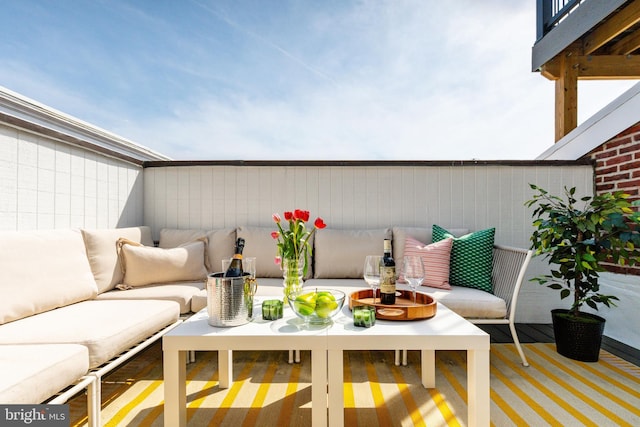 balcony with a patio and an outdoor hangout area