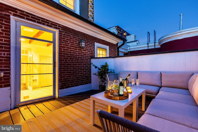 wooden deck featuring an outdoor living space and fence