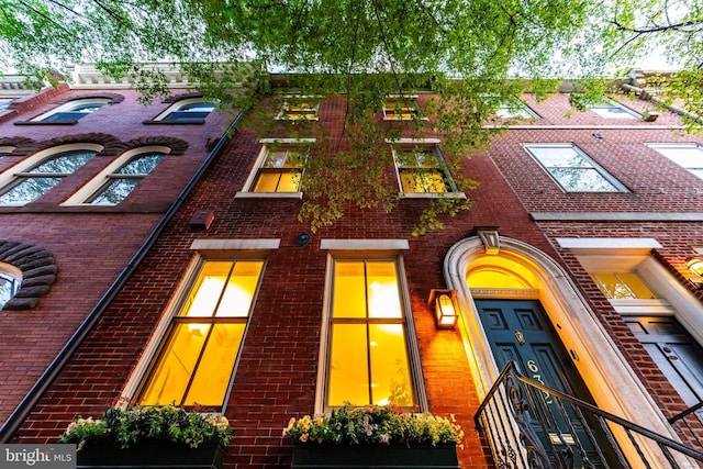 view of front of house with brick siding