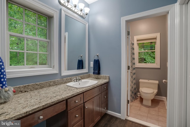 12868 Paddle Wheel Ct, Manassas, VA 20112 - bathroom featuring vanity, baseboards, toilet, and wood finished floors