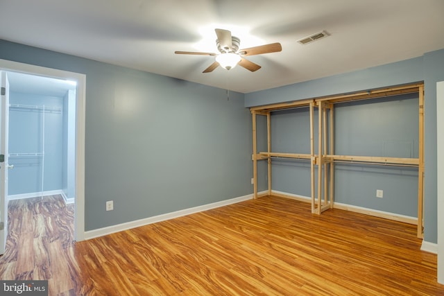 12868 Paddle Wheel Ct, Manassas, VA 20112 - unfurnished bedroom featuring wood finished floors, baseboards, and ceiling fan
