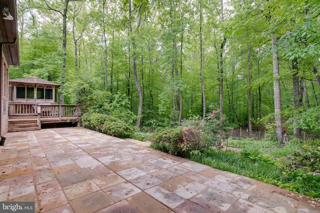 12868 Paddle Wheel Ct, Manassas, VA 20112 - view of patio featuring a deck, a wooded view, and fence