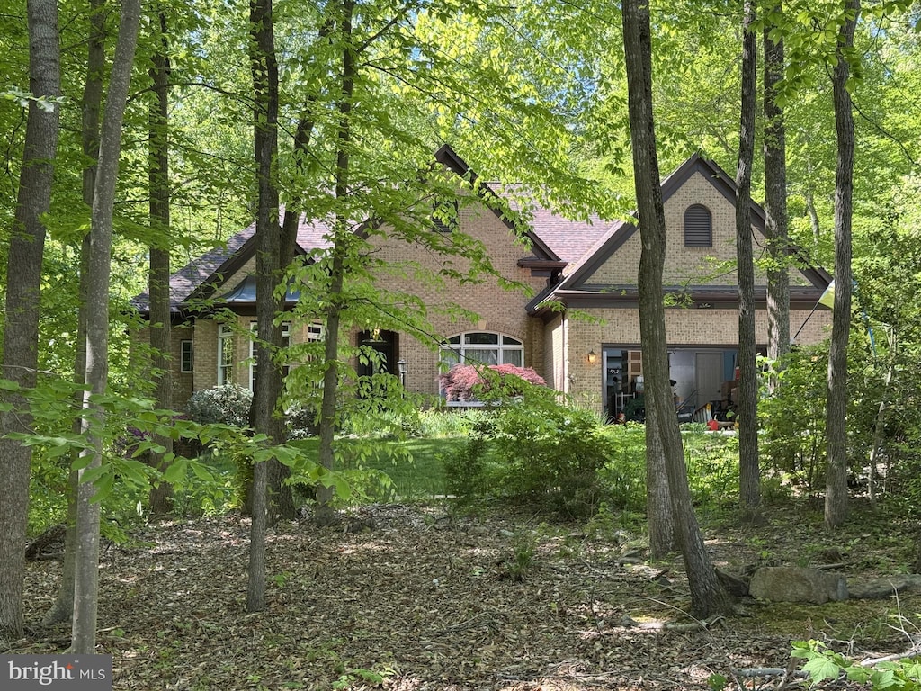 exterior space with brick siding