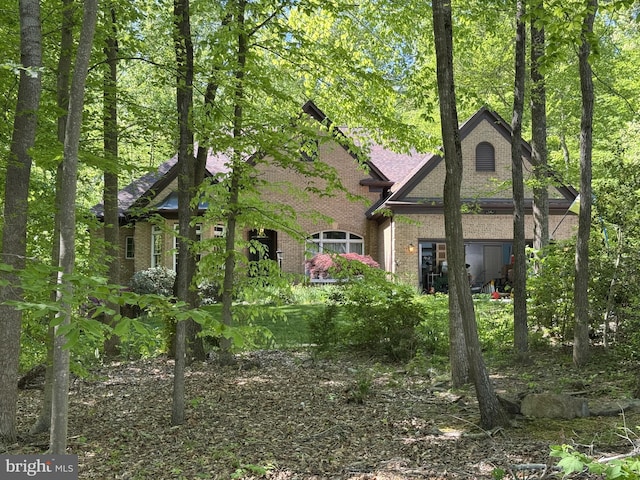 exterior space with brick siding