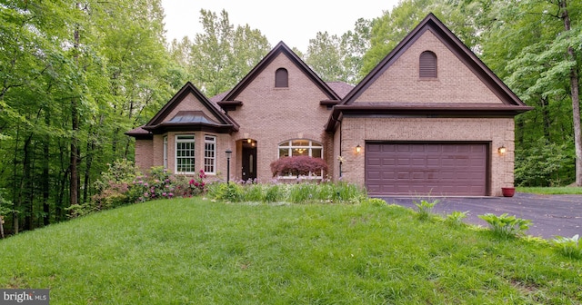 12868 Paddle Wheel Ct, Manassas, VA 20112 - view of front of home with brick siding, asphalt driveway, an attached garage, and a front lawn