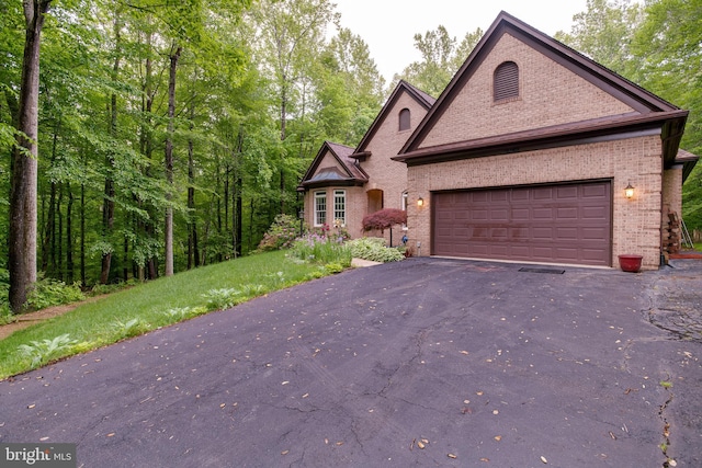 12868 Paddle Wheel Ct, Manassas, VA 20112 - view of front of home featuring brick siding, asphalt driveway, and an attached garage