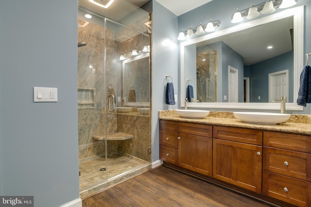 12868 Paddle Wheel Ct, Manassas, VA 20112 - full bathroom featuring wood finished floors, a stall shower, and double vanity