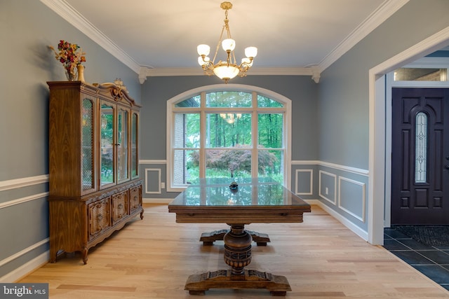 12868 Paddle Wheel Ct, Manassas, VA 20112 - foyer featuring a chandelier, crown molding, a decorative wall, a wainscoted wall, and light wood finished floors
