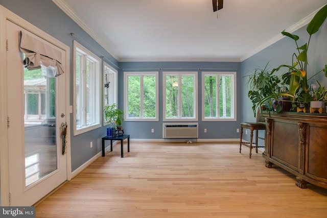 12868 Paddle Wheel Ct, Manassas, VA 20112 - sitting room featuring a wall mounted AC, plenty of natural light, light wood-style flooring, and crown molding