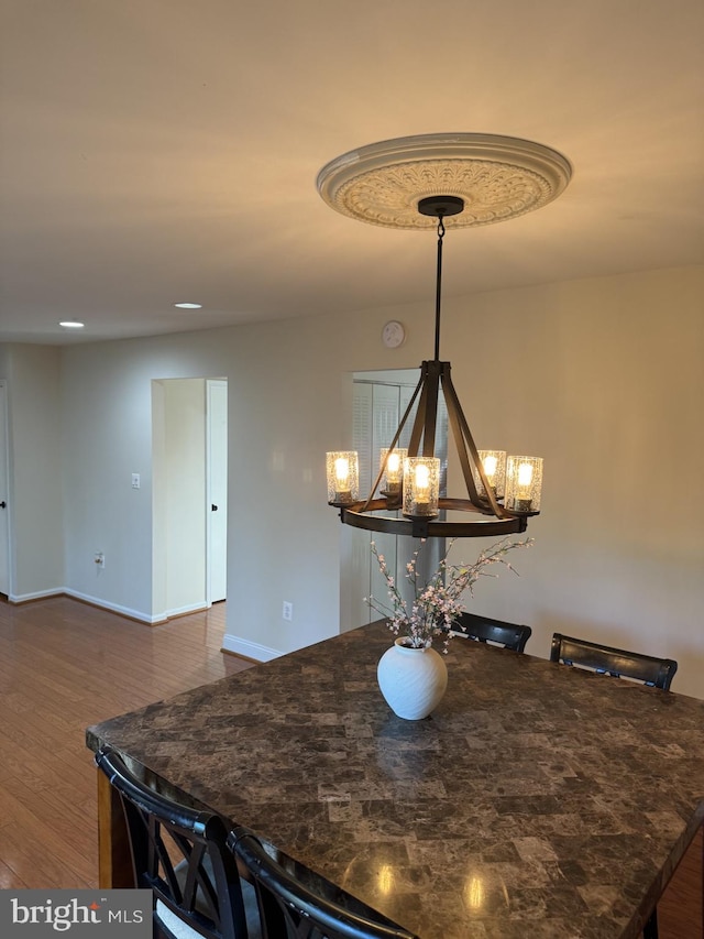 8549 Stonewall Rd, Manassas, VA 20110 - dining area with an inviting chandelier, recessed lighting, baseboards, and dark wood finished floors