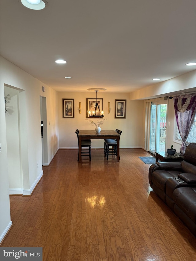 8549 Stonewall Rd, Manassas, VA 20110 - dining room featuring baseboards, dark wood-style flooring, an inviting chandelier, and recessed lighting