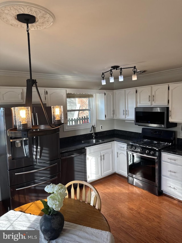 8549 Stonewall Rd, Manassas, VA 20110 - kitchen featuring a sink, dark countertops, white cabinetry, and black appliances