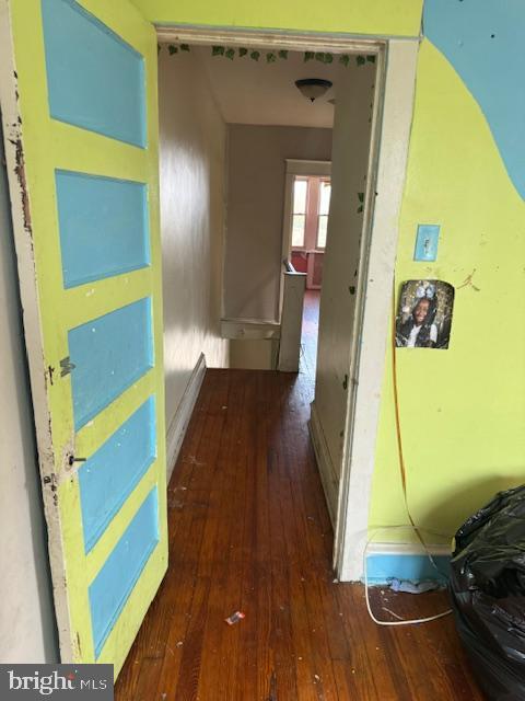 hallway featuring hardwood / wood-style flooring