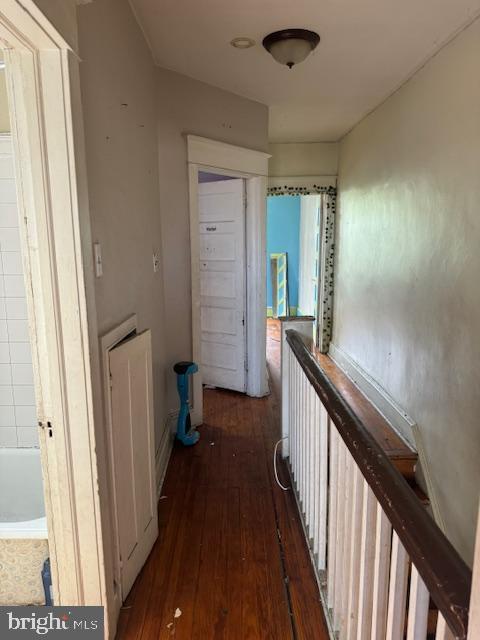 hallway featuring wood-type flooring