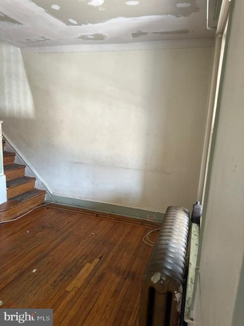 interior space featuring hardwood / wood-style flooring and stairs