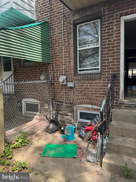 details with brick siding and electric meter