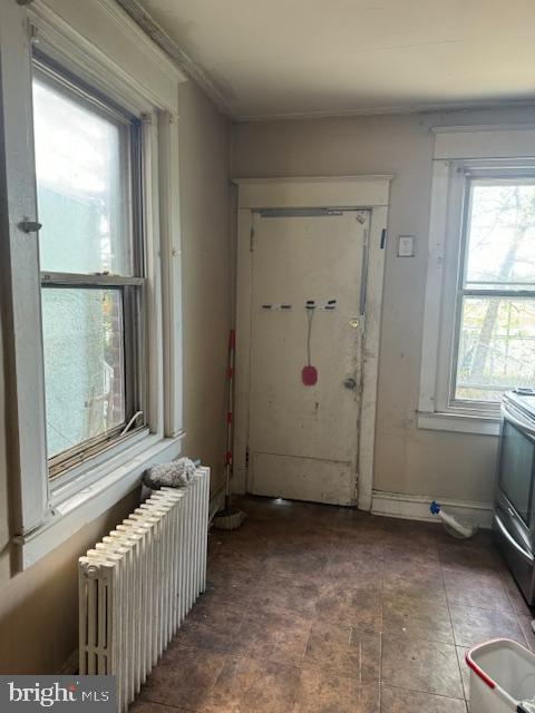 doorway featuring radiator
