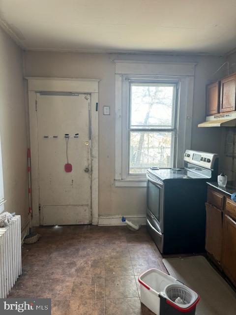 doorway to outside with radiator heating unit
