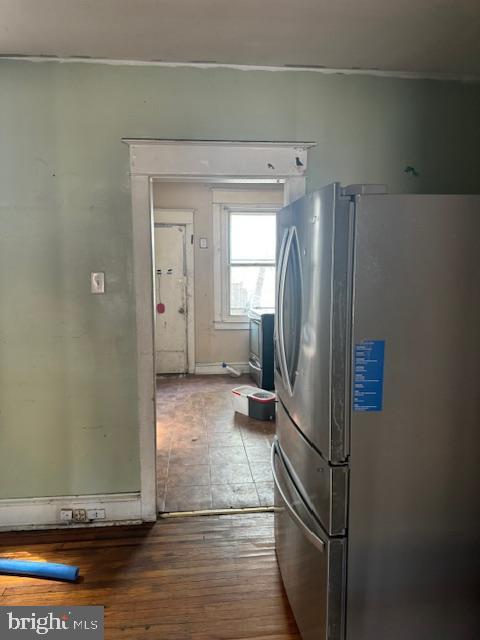clothes washing area featuring hardwood / wood-style floors