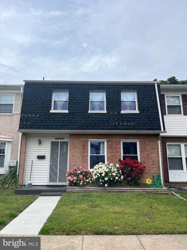 14743 Tamarack Pl, Woodbridge, VA 22191 - view of property with mansard roof, roof with shingles, brick siding, and a front yard