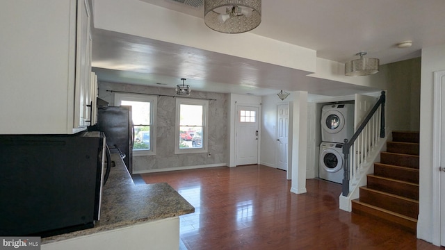 14743 Tamarack Pl, Woodbridge, VA 22191 - entryway with stacked washing machine and dryer, stairs, and wood finished floors